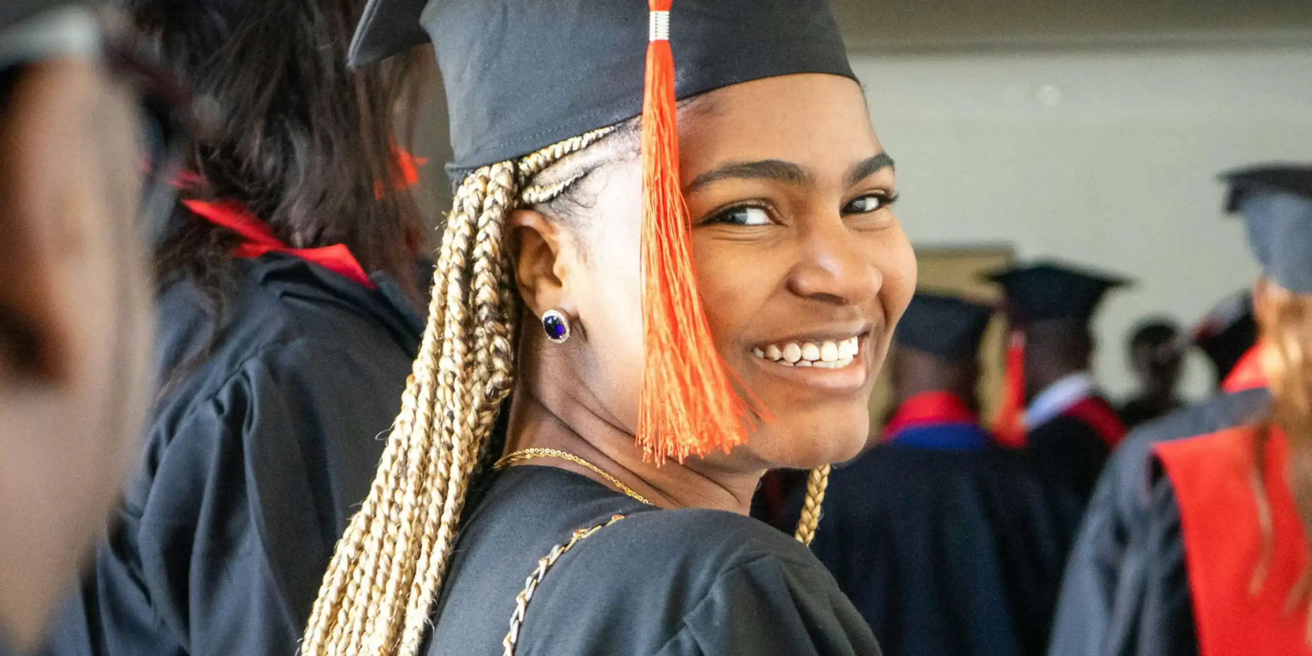woman-in-graduation-robe@2x